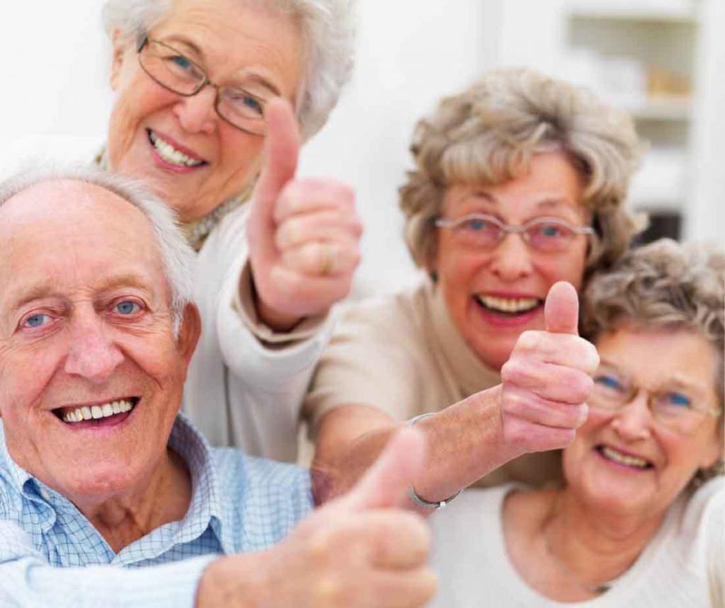 Seniors Laughing with thumbs up