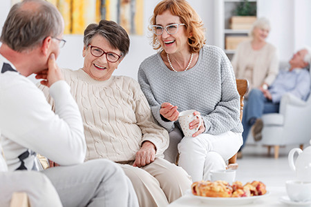 Senior club concept, group of elderly people talking and enjoying each other's company