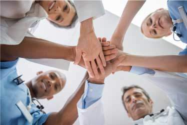 Doctors and Nurses in a huddle