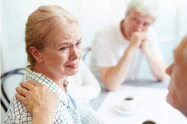 Elderly couple looking very stressed out