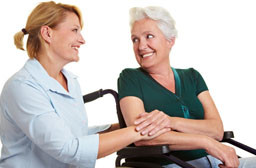 Home care nurse with patient in wheelchair