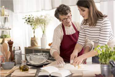 Mother and daughter reading a recipe together