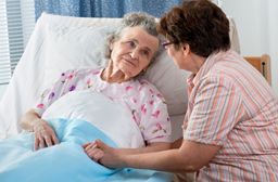 bedside nurse with hospice patient